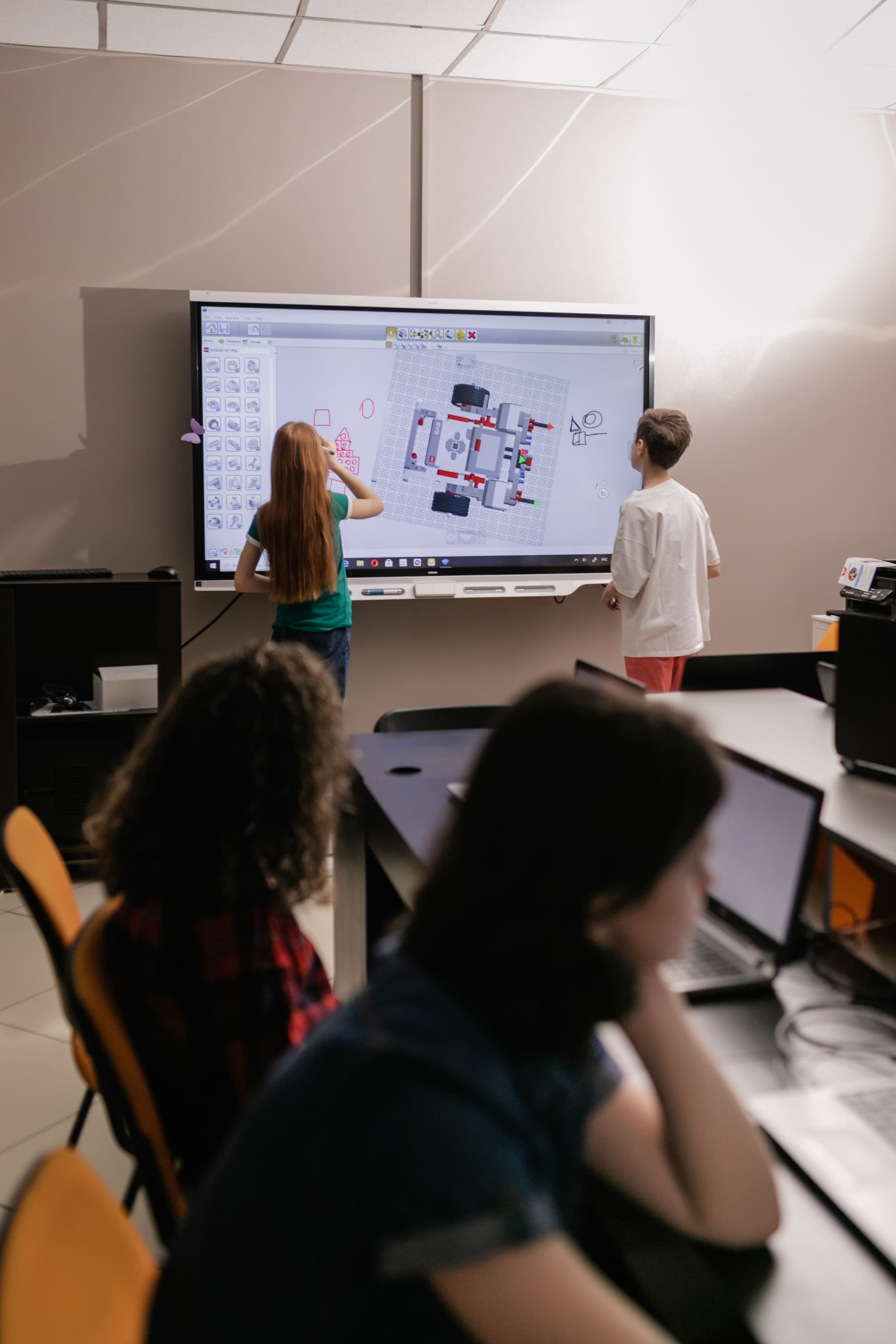 Students in classroom with interactive whiteboard